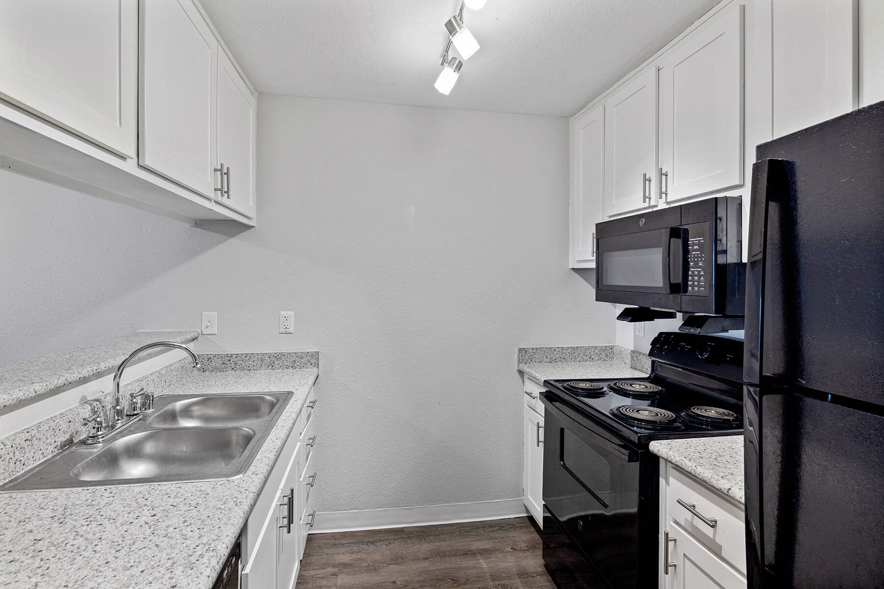 Black kitchen appliances at Hilltop Commons Apartments in San Pablo CA